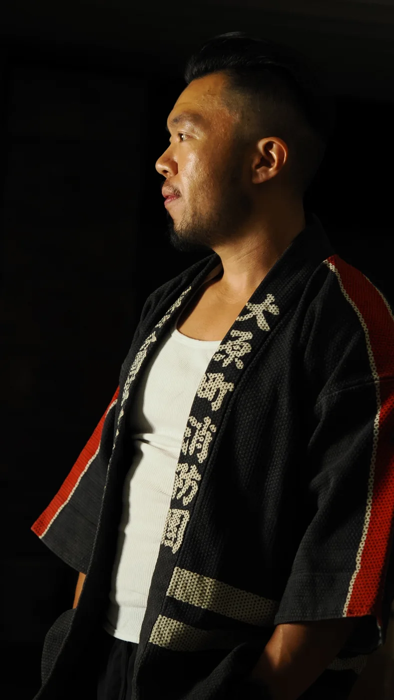 Gavin Fu in profile against a dark background