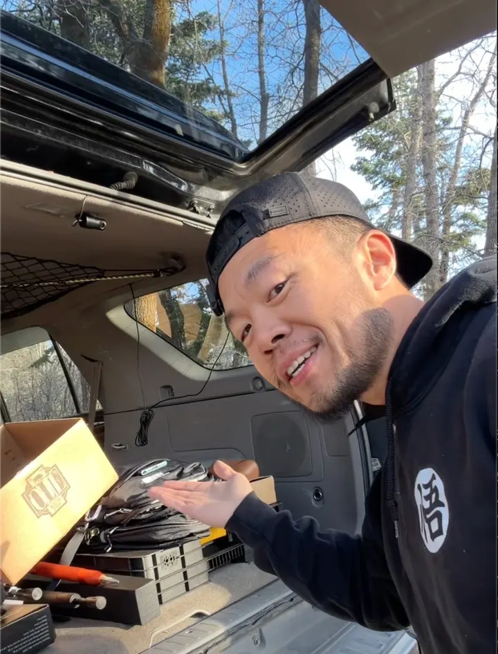 Gavin demonstrating gear at the back of a vehicle